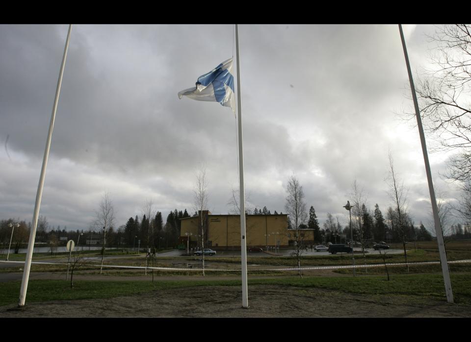 Pekka-Eric Auvinen kills six fellow students, the school nurse, the principal and himself with a handgun at the Jokela High School near Helsinki. <br>  <em>Caption: The Finnish flag flies half staff outside Jokela school, rear, in Tuusula, Finland, Thursday Nov. 8, 2007. (AP Photo/Peter Dejong)</em>