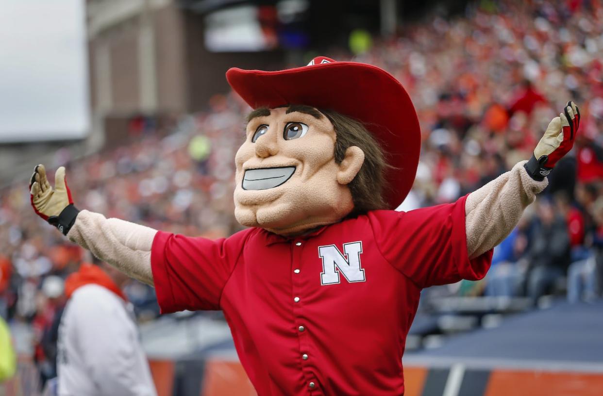 Nebraska Cornhuskers mascot Herbie Husker pumps up the crowd during a 2015 football game. <a href="https://www.gettyimages.com/detail/news-photo/nebraska-cornhuskers-mascot-herbie-husker-is-seen-during-news-photo/493666358?adppopup=true" rel="nofollow noopener" target="_blank" data-ylk="slk:Michael Hickey/Getty Images;elm:context_link;itc:0;sec:content-canvas" class="link ">Michael Hickey/Getty Images</a>