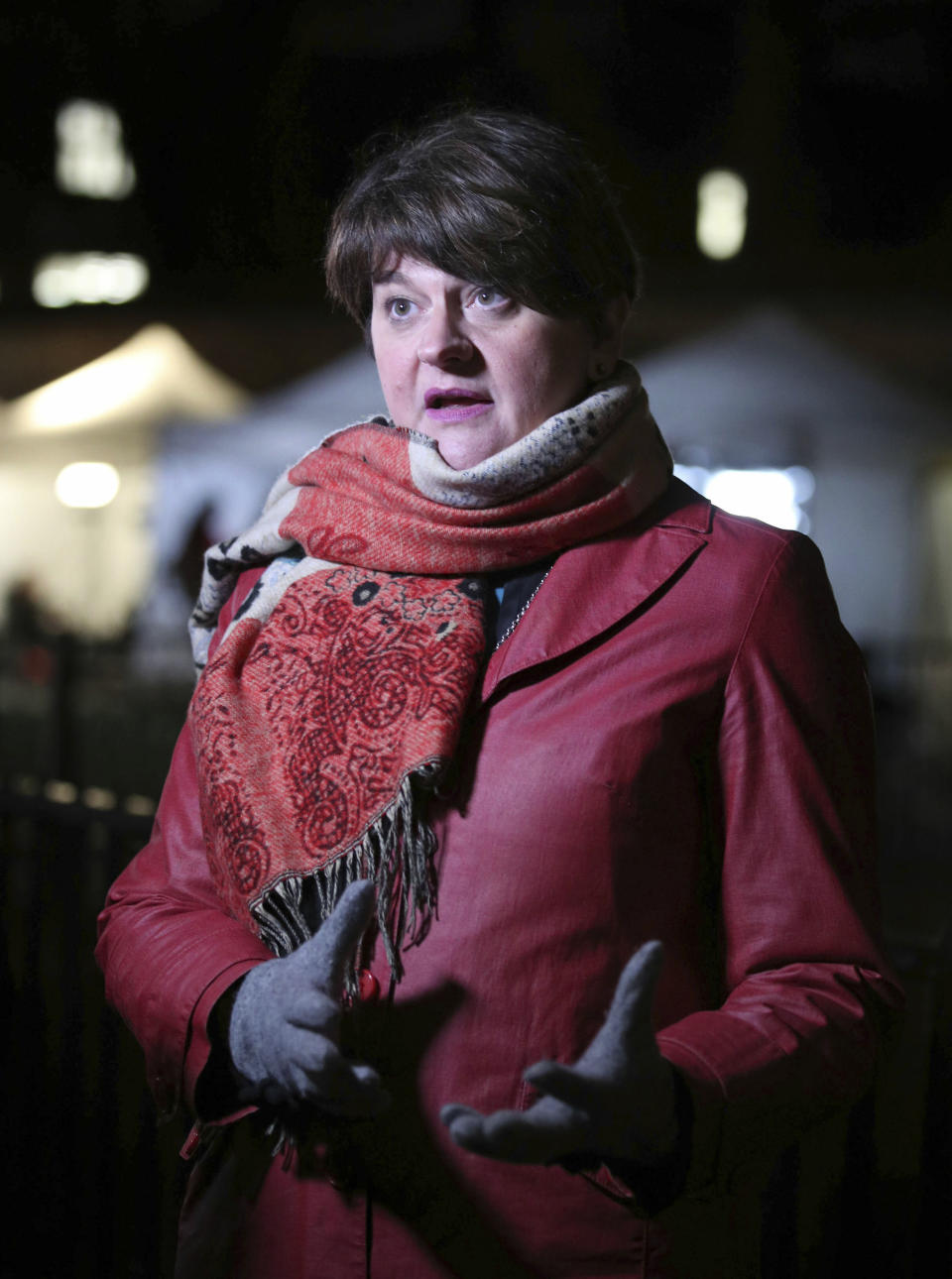 Democratic Unionist Party (DUP) of Northern Ireland, party leader Arlene Foster speaks to the media at College Green in Westminster, London, Wednesday Jan. 16, 2019. British Prime Minister Theresa May has defied calls to resign and has won a no confidence vote Wednesday. (Yui Mok/PA via AP)