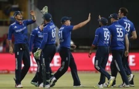 England cricket players celebrate the dismissal of South Africa's captain AB de Villiers who was caught out by Ben Stokes during the first ODI cricket match in Bloemfontein, South Africa, February 3, 2016. REUTERS/Siphiwe Sibeko