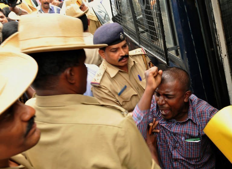 An Indian activist from the 'Campaign Against Child Labour' is arrested during a demonstration outside the French consulate in Bangalore, on June 18, 2012. The Indian wife of a French consular official charged with raping their daughter has demanded a meeting with Francois Hollande, presenting the French president with a thorny diplomatic dilemma on his first state visit to India