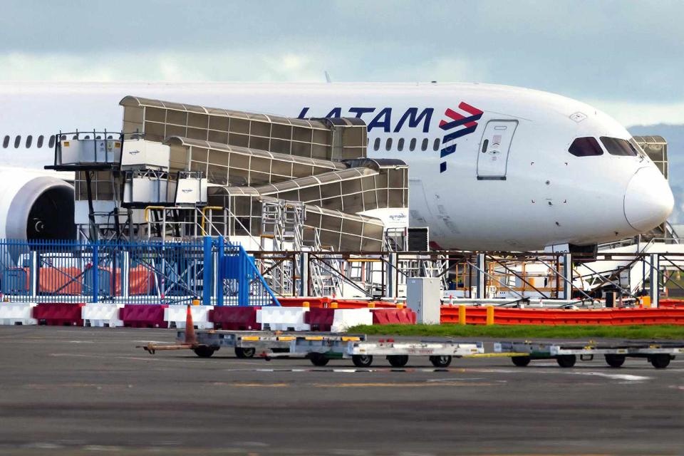 <p>BRETT PHIBBS/AFP via Getty</p> The LATAM Airlines Boeing 787 Dreamliner plane at Auckland Airport.