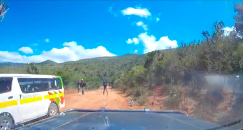 The group had been driving along the remote road and noticed a minibus stopped. When it pulled away they released there were three bandits behind it. Source: Storyful