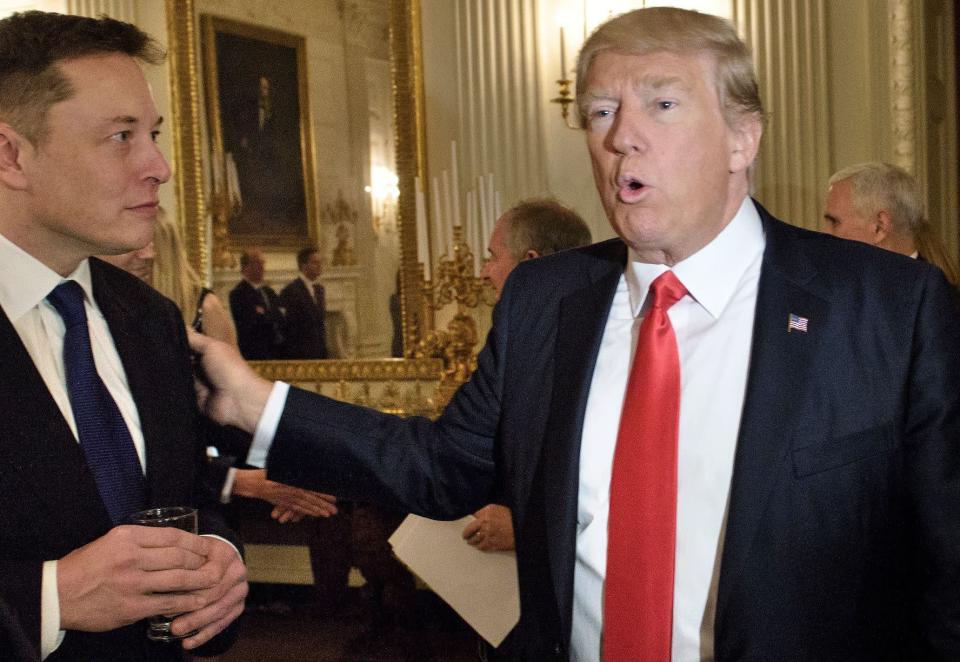 President Donald Trump greets Elon Musk, SpaceX and Tesla CEO, before a policy and strategy forum with executives in the State Dining Room of the White House February 3, 2017 in Washington, DC. (Photo: BRENDAN SMIALOWSKI/AFP/Getty Images)