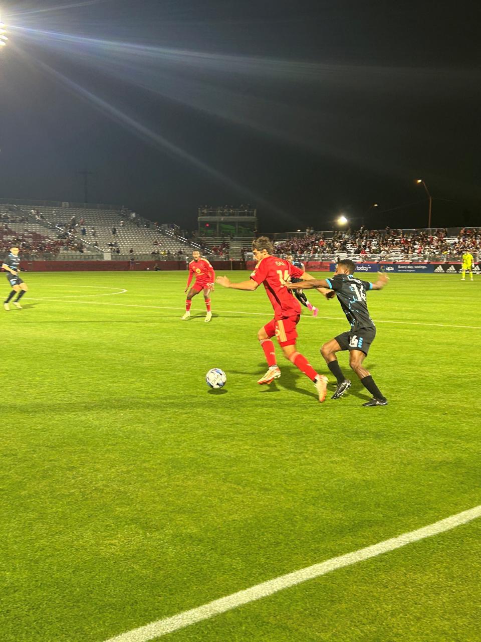 Phoenix Rising's Gabriel Torres dribbling through the defense at Phoenix Rising Stadium on April 13, 2024.