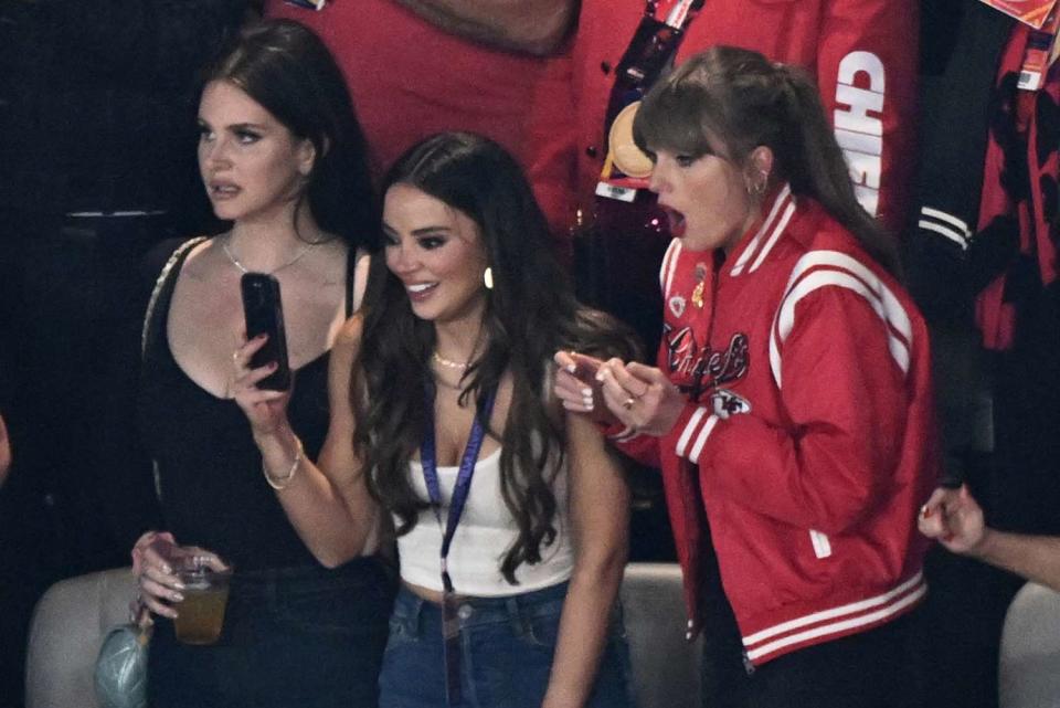 <p>Patrick T. Fallon / AFP via Getty</p> Lana Del Rey is seen with  Keleigh Sperry and Taylor Swift at the 2024 Super Bowl