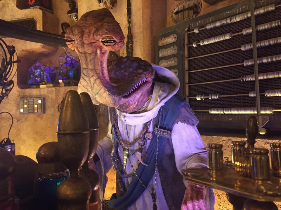 An animatronic Dok-Ondar keeps an eye on things at the Den of Antiquities shop at Star Wars: Galaxy's Edge in Disneyland.