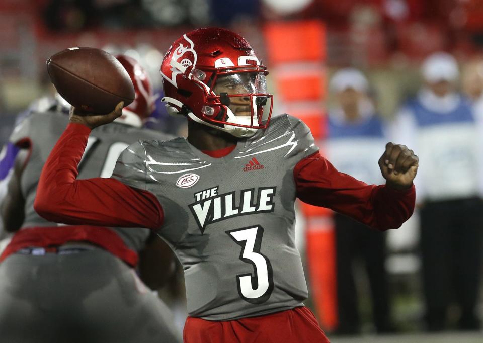 Louisville’s  Malik Cunningham throws for a first down against James Madison.Nov. 5, 2022