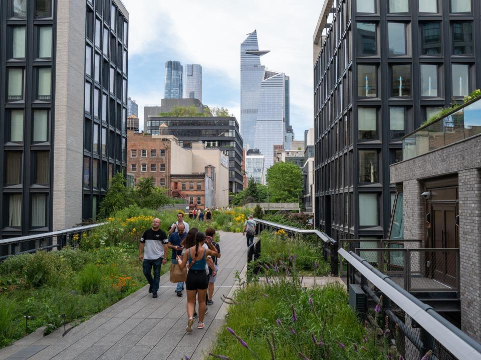 People walk along the High Line in New York City.