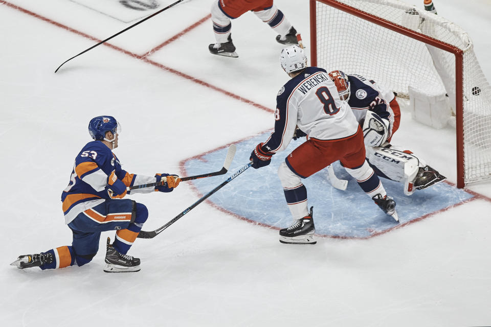 New York Islanders' Casey Cizikas, left, scores during the third period against Columbus Blue Jackets goalie Sergei Bobrovsky on Saturday, Dec. 1, 2018, in Uniondale, N.Y. (AP Photo/Andres Kudacki)