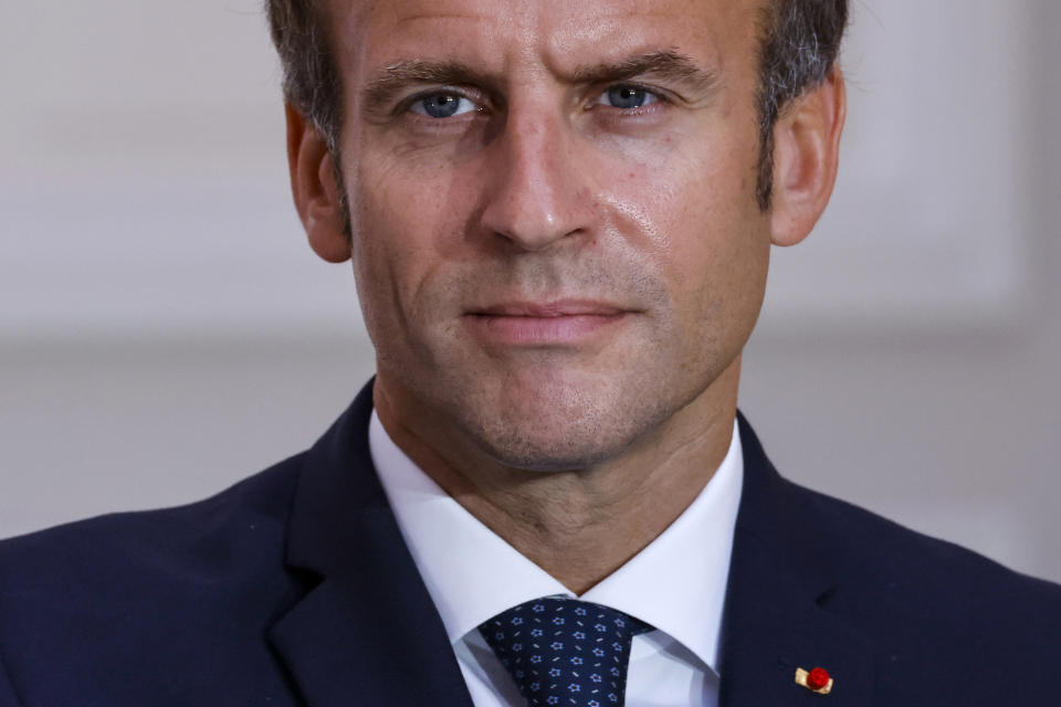 French President Emmanuel Macron looks on during the signing of a new defense deal at The Elysee Palace Tuesday, Sept. 28, 2021 in Paris. France and Greece announced on Tuesday a major, multibillion-euro defense deal including Athens' decision to buy three French warships. (Ludovic Marin, Pool Photo via AP)