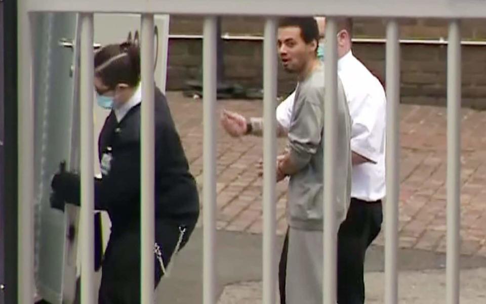 Callum Wheeler is led away from court on Tuesday morning before being remanded into custody  - Pixel8000/BBC