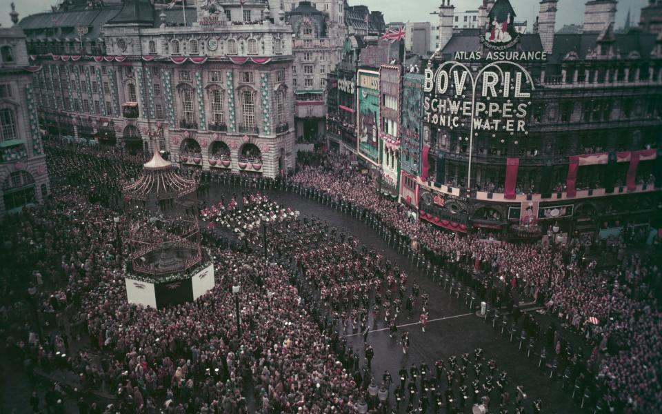 Queen Elizabeth's procession marched down Regent Street and through Piccadilly Circus - Rolls Press/Popperfoto