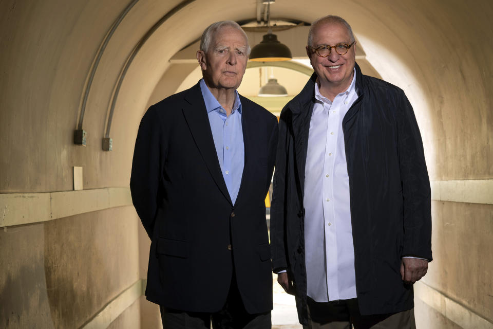 This image released by Apple TV+ shows John le Carré, left, and filmmaker Errol Morris on the set of "The Pigeon Tunnel." (Des Willie/Apple TV+ via AP)