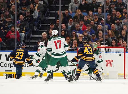 Feb 5, 2019; Buffalo, NY, USA; Buffalo Sabres center Sam Reinhart (23) scores on Minnesota Wild goaltender Devan Dubnyk (40) during the third period at KeyBank Center. Mandatory Credit: Kevin Hoffman-USA TODAY Sports