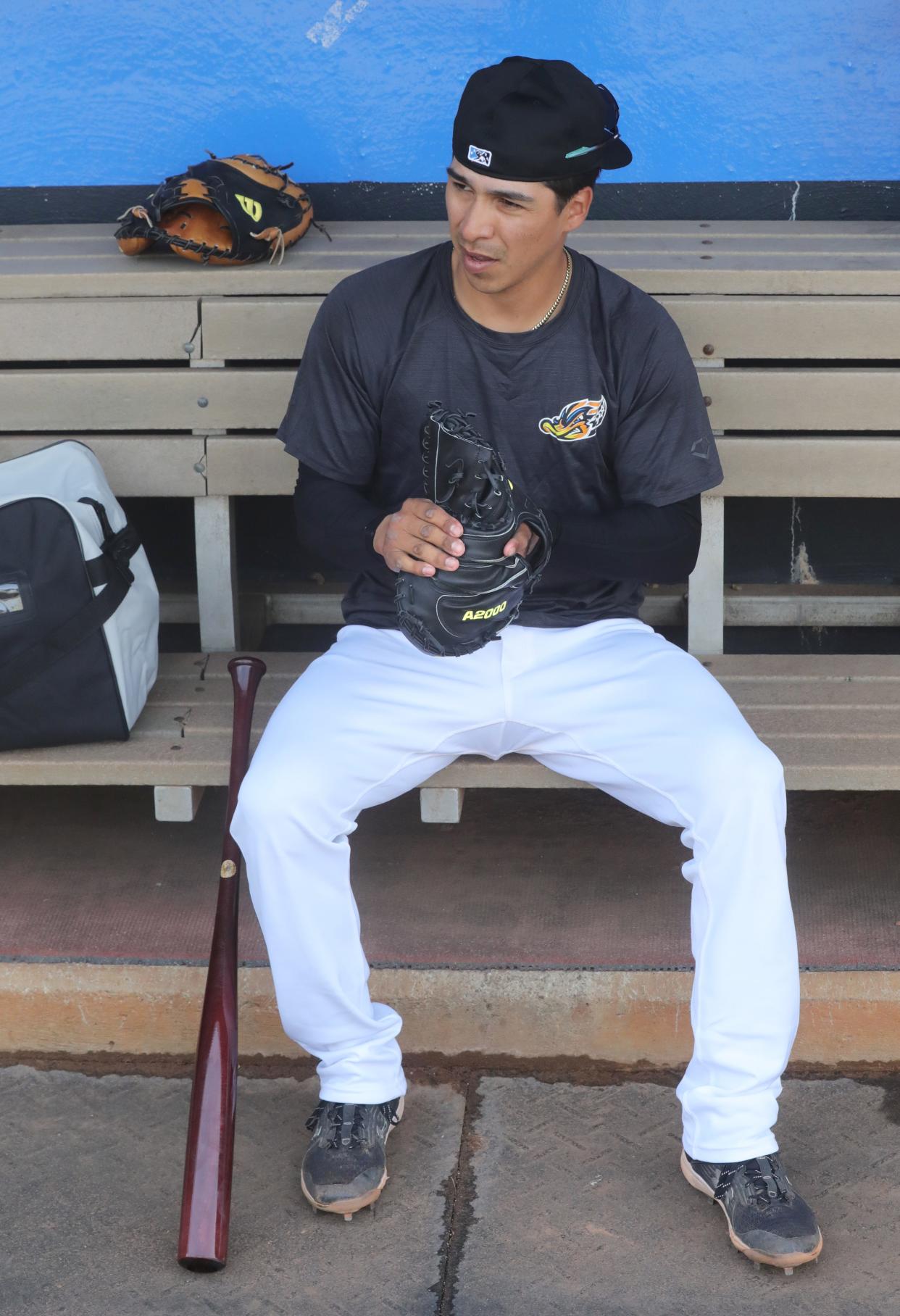 RubberDucks catcher Michael Berglund works in a new glove, Tuesday, April 4, 2023.