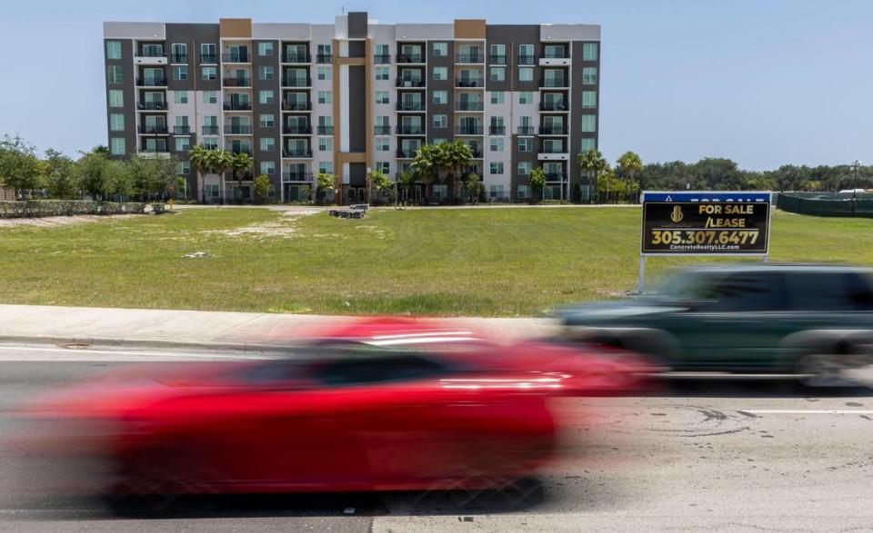 A view of The Pomelo apartments and a vacant lot near Northwest 27th Avenue and Northwest 191st Street on Wednesday, May 10, 2023, in Miami Gardens, Fla. Developers are preparing to construct a new destination district in the area, which will be named the Miami Gardens City Center.