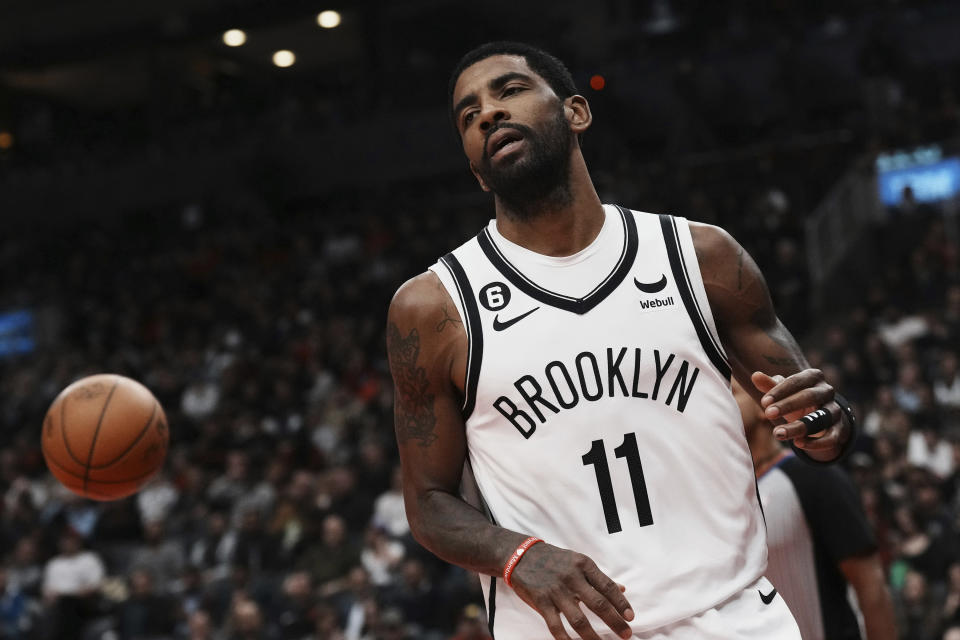 Brooklyn Nets' Kyrie Irving reacts during the second half of the team's NBA basketball game against the Toronto Raptors on Wednesday, Nov. 23, 2022, in Toronto. (Chris Young/The Canadian Press via AP)