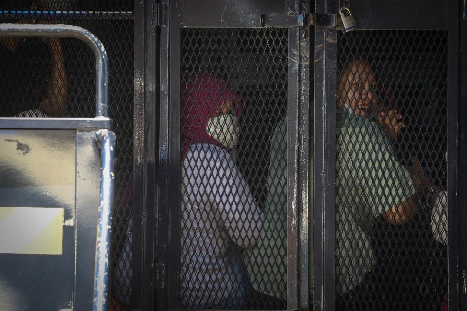 Illegal immigrants are detained by the Immigration Department following raids carried out at Selayang Baru in Kuala Lumpur May 14, 2020. — Picture by Yusof Mat Isa