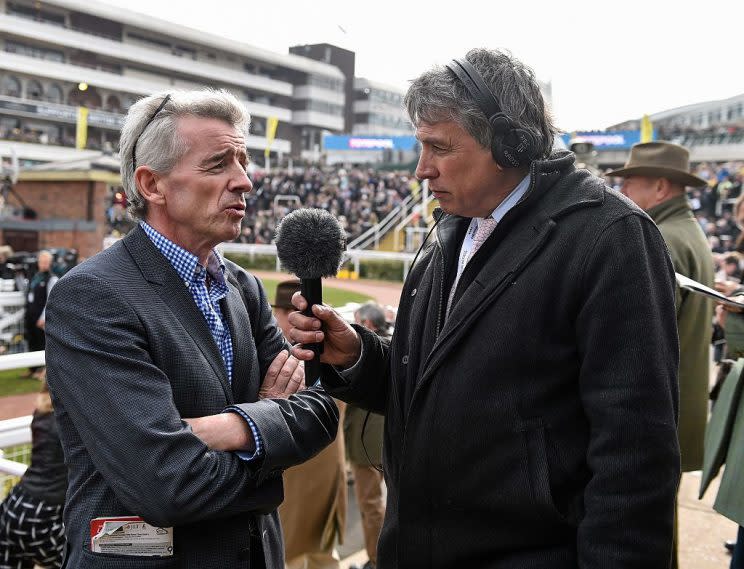 12 March 2015; Michael O'Leary, CEO of Ryanair, is interviewed by BBC presenter John Inverdale ahead of the day's racing. Cheltenham Racing Festival 2015, Prestbury Park, Cheltenham, England. Picture credit: Ramsey Cardy / SPORTSFILE (Photo by Sportsfile/Corbis via Getty Images)
