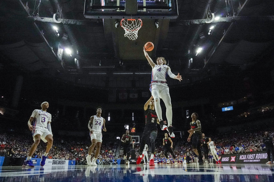 Kansas' Gradey Dick shoots past Howard's Steve Settle III during first half of a first-round college basketball game in the NCAA Tournament Thursday, March 16, 2023, in Des Moines, Iowa. (AP Photo/Morry Gash)