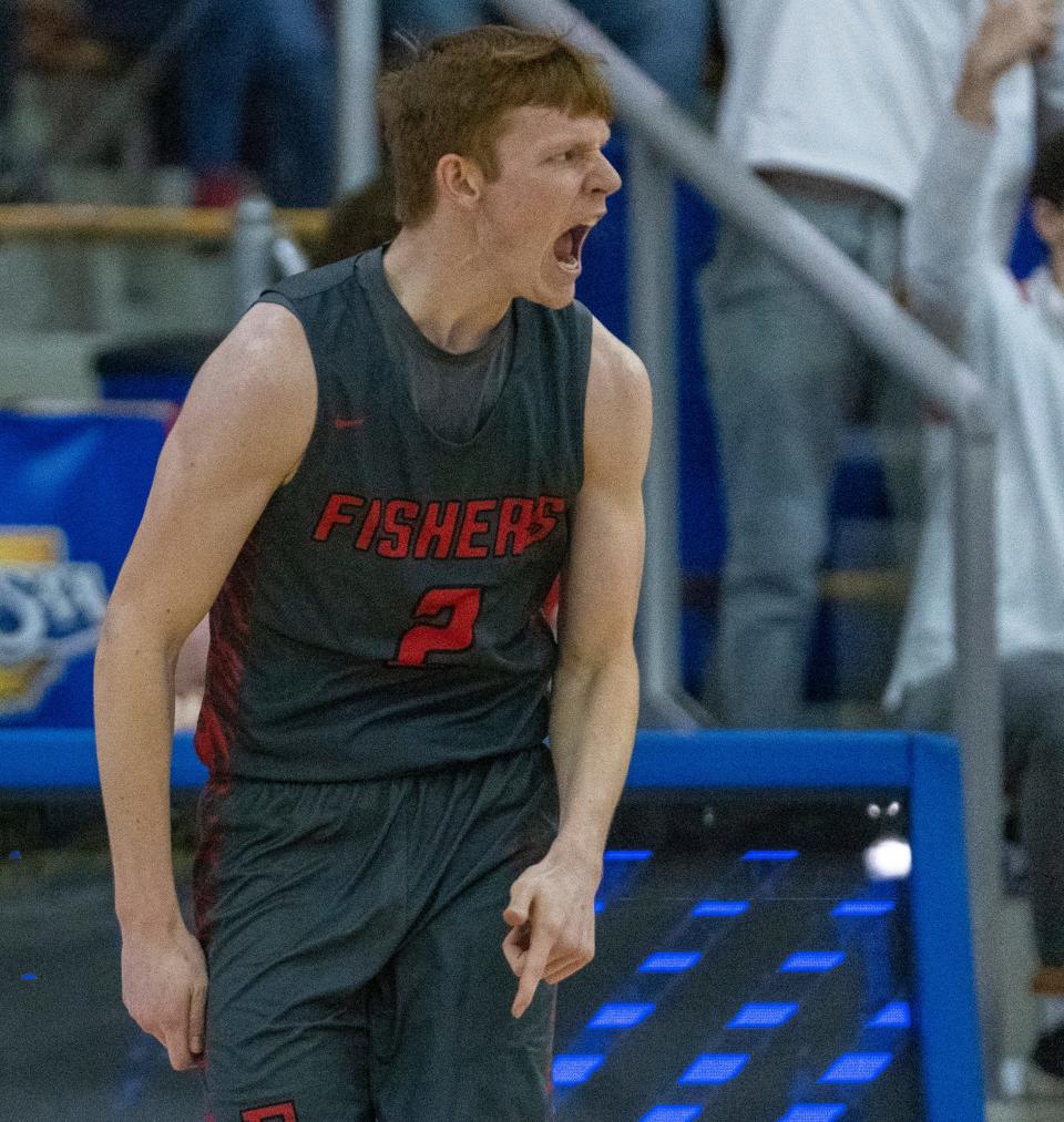 Fishers High School's guard Taden Metzger (2) gets pumped against rival Hamilton Southeastern High School at Carmel High School, Tuesday, Feb. 28, 2023, during the Fishers boys’ sectional win over HSE, 68-49. 