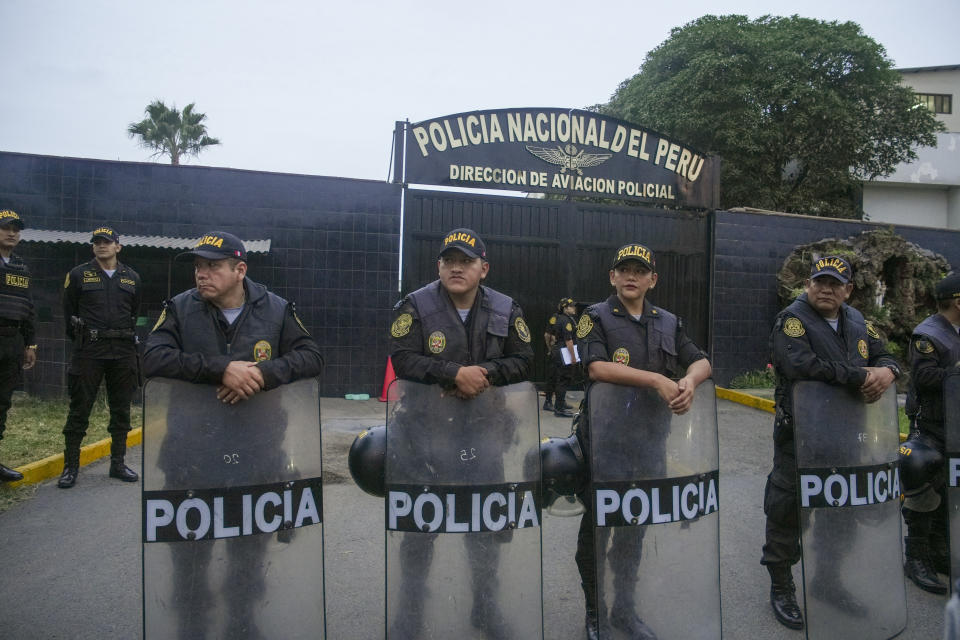 Police guard the entrance to the police terminal next to the international airport from where Peru's former President Alejandro Toledo will be taken to a detention facility after arriving in Lima, Peru, extradited from the United States, Sunday, April 23, 2023. Toledo will face charges for allegedly receiving bribes from the Brazilian construction company Odebrecht in return for awarding public works contract while in office between 2001 and 2006. (AP Photo/Guadalupe Pardo)