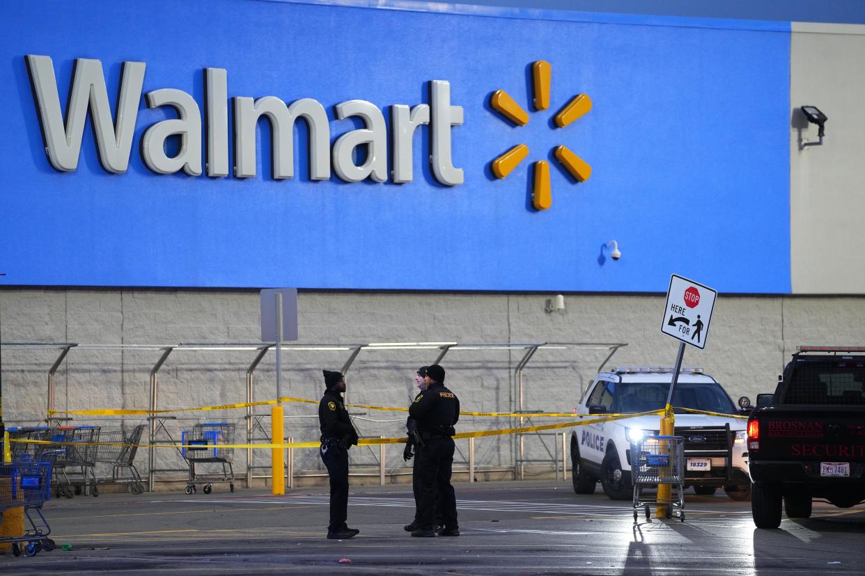 Cincinnati police investigate a homicide in the parking lot of a Walmart in the 2300 block of Ferguson Road, Saturday, Nov. 27, 2021, in the Westwood neighborhood of Cincinnati. 