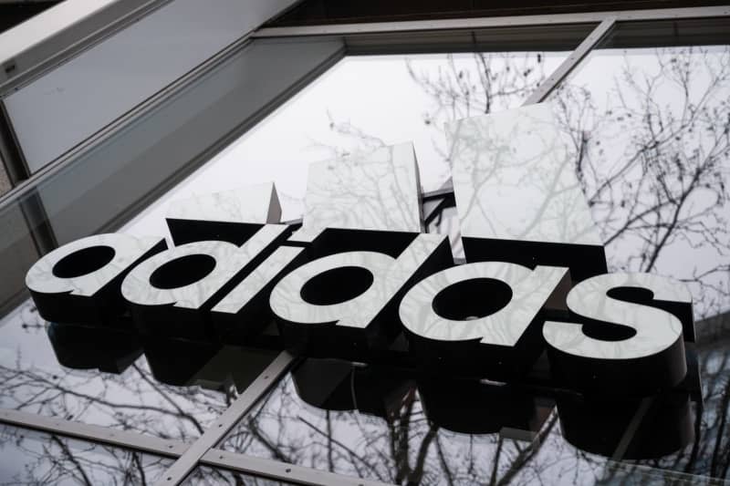 The Adidas logo is pictured on a store in Berlin. Christophe Gateau/dpa