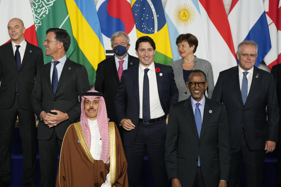 Netherland's Prime Minister Mark Rutte, second left, Canada's Prime Minister Justin Trudeau, center, and other world leaders pose for a group photo of world leaders at the La Nuvola conference center for the G20 summit in Rome, Saturday, Oct. 30, 2021. The two-day Group of 20 summit is the first in-person gathering of leaders of the world's biggest economies since the COVID-19 pandemic started. (AP Photo/Gregorio Borgia)