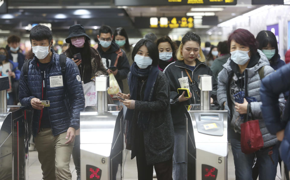 People wear masks at a metro station in Taipei, Taiwan, Tuesday, Jan. 28, 2020. According to the Taiwan Centers of Disease Control (CDC) Tuesday, the eighth case diagnosed with the 2019 novel coronavirus (2019-nCoV) has been confirmed in Taiwan. (AP Photo/Chiang Ying-ying)