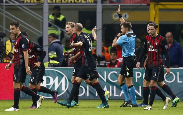 Referee Nicola Rizzoli (2-R) invalidates a goal during the match between AC Milan and Juventus on October 22, 2016 at the San Siro Stadium