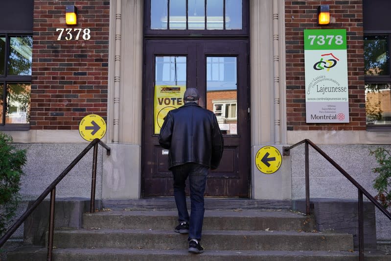 A man enters a polling place to cast his ballot for today's election in Montreal
