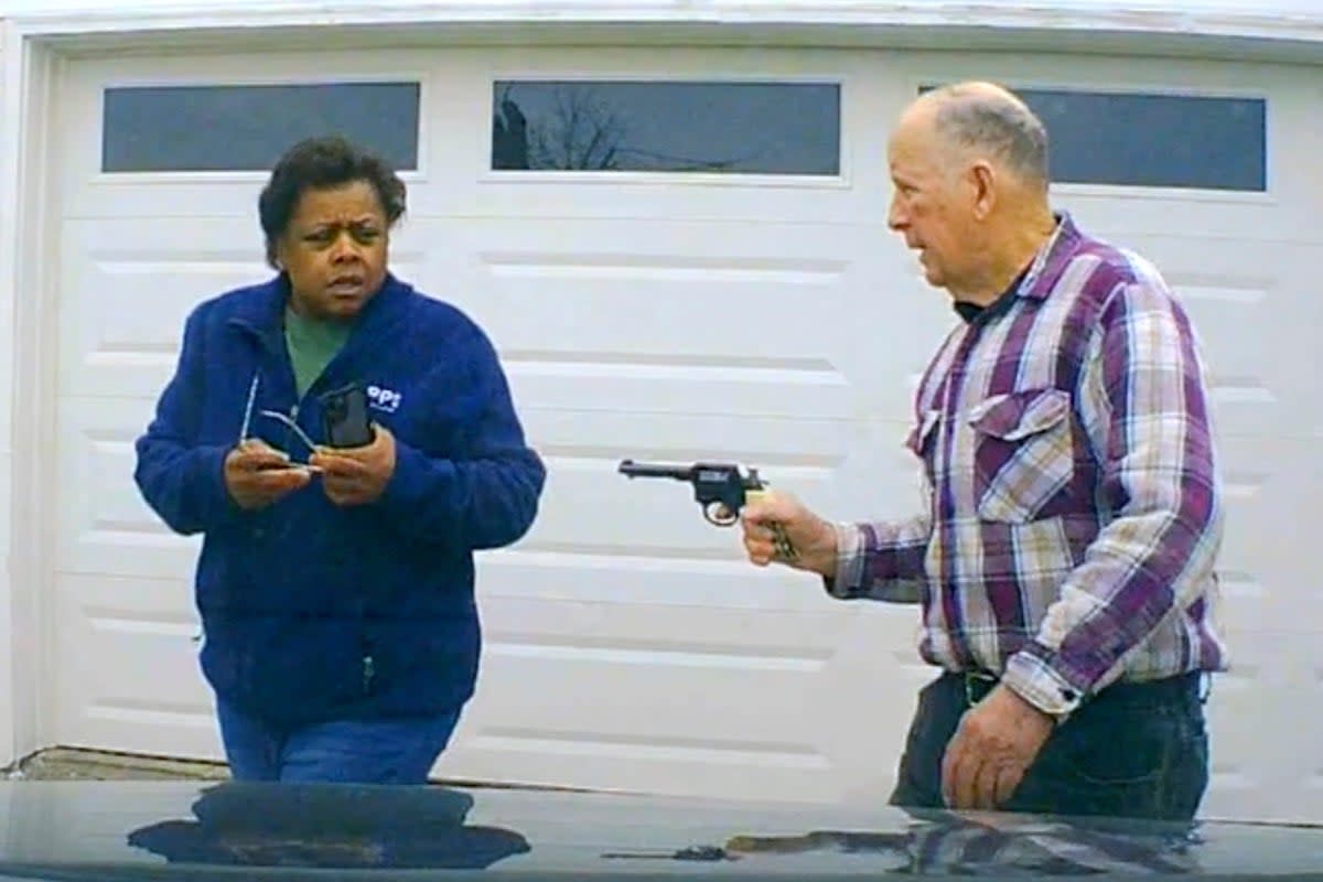 In this image taken from Uber dashcam video released by the Clark County, Ohio, Sheriff's Office, William Brock, right, holds a weapon to Uber driver Loletha Hall outside his home in South Charleston, Ohio, on March 25, 2024 (Clark County Sheriff’s Office)