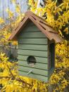 <p>If you're looking for garden ideas for wildlife, you could install a bird feeder, bird bath or bird house. More birds attracted to your outdoor space will also mean more chances of listening to the sound of birds singing, which is great for your wellbeing. In fact, <a href="https://www.housebeautiful.com/uk/garden/a27452863/kate-humble-sounds-of-spring-campaign/" rel="nofollow noopener" target="_blank" data-ylk="slk:research shows that listening to the sound of birds;elm:context_link;itc:0;sec:content-canvas" class="link ">research shows that listening to the sound of birds</a> can help lower stress and fatigue, as well as helping to combat <a href="https://www.housebeautiful.com/uk/garden/plants/a21744447/flowers-to-boost-mood-mind-rhs-garden/" rel="nofollow noopener" target="_blank" data-ylk="slk:anxiety;elm:context_link;itc:0;sec:content-canvas" class="link ">anxiety</a>.</p><p>You could buy one (shop a selection at the <a href="https://go.redirectingat.com?id=127X1599956&url=https%3A%2F%2Fshopping.rspb.org.uk%2Fbird-feeders%2F&sref=https%3A%2F%2Fwww.housebeautiful.com%2Fuk%2Fgarden%2Fdesigns%2Fg28%2Fgarden-ideas-on-a-budget%2F" rel="nofollow noopener" target="_blank" data-ylk="slk:RSPB;elm:context_link;itc:0;sec:content-canvas" class="link ">RSPB</a>) or, if you're looking for a cheaper way, wash out old tin cans (from soup and baked beans), then paint, fill with bird seed, and hang in the garden for your own homemade bird feeder.</p><p><strong>Pictured: </strong>Bird feeder in Moorland Green Wood Paint, <a href="https://thorndown.co.uk/product/moorland-green-wood-paint/" rel="nofollow noopener" target="_blank" data-ylk="slk:Thorndown Paints;elm:context_link;itc:0;sec:content-canvas" class="link ">Thorndown Paints</a></p>