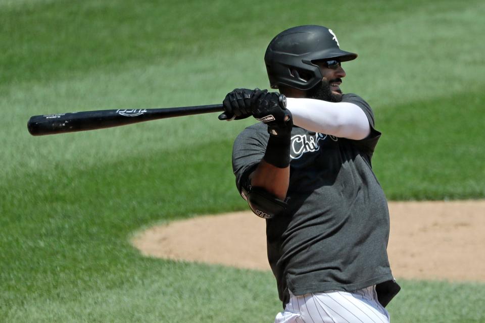 FILE - In this July 9, 2020, file photo, Chicago White Sox's Nomar Mazara hits during baseball practice at Guaranteed Rate Field in Chicago. Mazara and the Detroit Tigers finalized a $1.75 million, one-year contract on Friday, Feb. 12, 2021. (AP Photo/Nam Y. Huh, File)