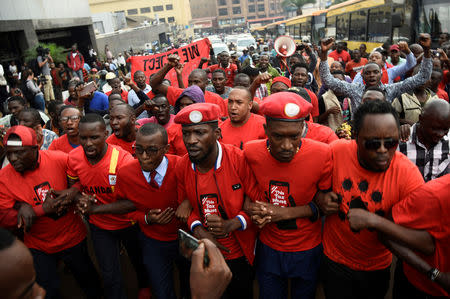 Ugandan musician turned politician, Robert Kyagulanyi (C) leads activists during a demonstration against new taxes including a levy on access to social media platforms in Kampala, Uganda July 11, 2018. Picture taken July 11, 2018. REUTERS/Newton Nambwaya