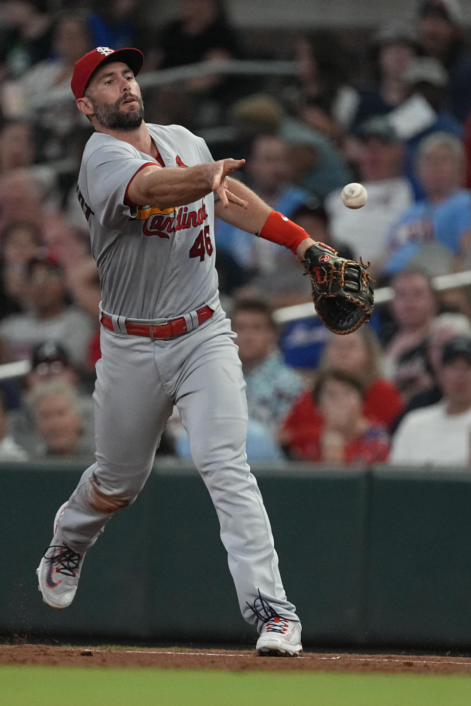 St. Louis Cardinals first baseman Paul Goldschmidt (46) tosses the ball to first base after fielding a ground ball from Atlanta Braves' Michael Harris II in the third inning of a baseball game Wednesday, Sept. 6, 2023, in Atlanta. (AP Photo/John Bazemore)