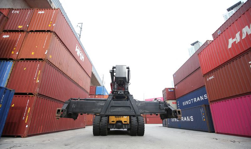 Containers holding tires are stacked at a yard of a tire factory on the 11th day of a nationwide strike by truckers in Daejeon