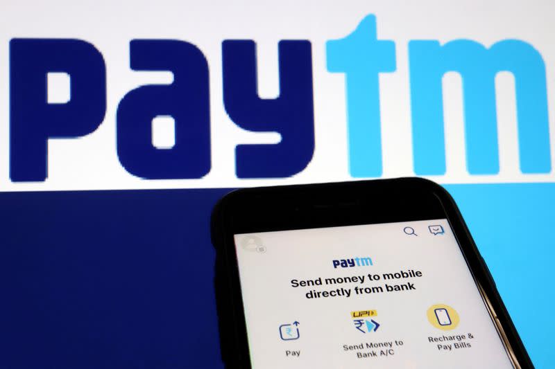 FILE PHOTO: The interface of Indian payments app Paytm is seen in front of its logo displayed in this illustration picture