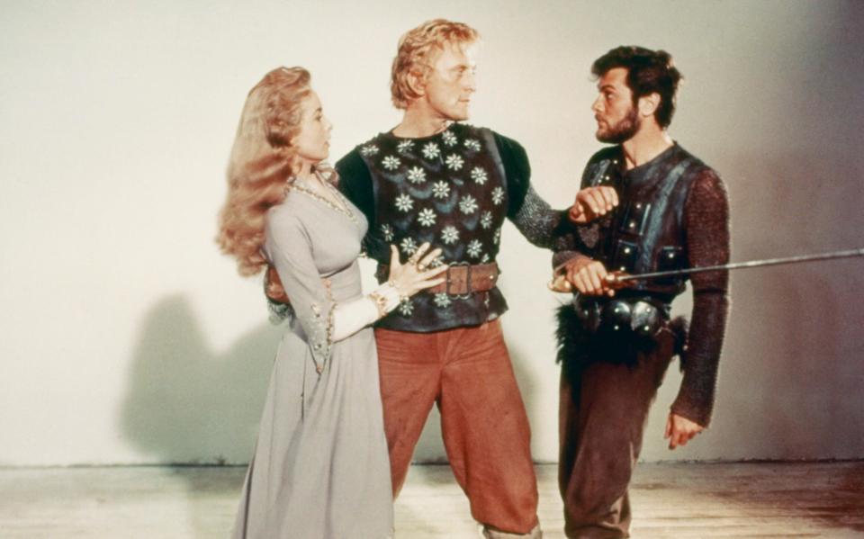 Janet Leigh, Kirk Douglas and Tony Curtis in a publicity still for The Vikings - Getty