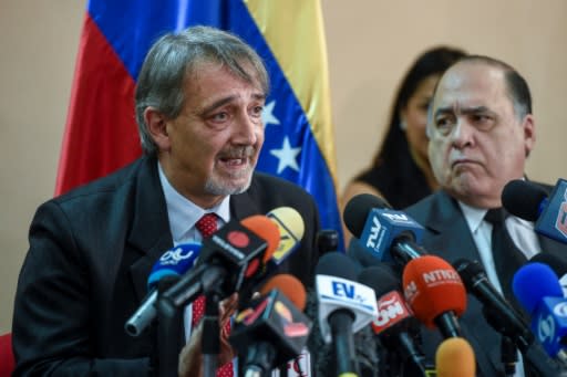 The head of the International Federation of Red Cross and Red Crescent Societies (IFRC) Francesco Rocca (L), speaks during a press conference in Caracas, on March 29, 2019