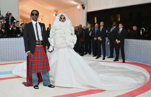 Rihanna & A$AP Rocky Light Up The 2023 Met Gala After He Climbed Over Crowd