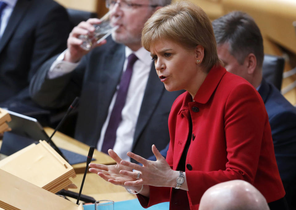 Scotland's First Minister Nicola Sturgeon speaks during a debate on a second referendum on independence at Scotland's Parliament in Holyrood, Edinburgh, Tuesday March 28, 2017. On Monday British Prime Minister Theresa May has met Scotland's leader Nicola Sturgeon for the first time since they faced off in a struggle over a new push for Scottish independence as the U.K. leaves the European Union. (Russell Cheyne/PA via AP)