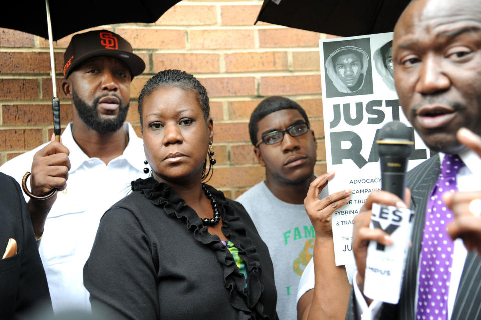 The family of Trayvon Martin, from left, father Tracy Martin, mother Sybrina Fulton, and brother Jahvaris Fulton visit Birmingham, Ala. Thursday, May 3, 2012 for a rally at Kelly Ingram Park. (AP Photo/The News, Linda Stelter) MAGS OUT