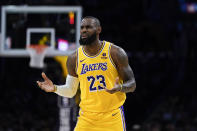 Los Angeles Lakers forward LeBron James gestures during the first half of the team's NBA basketball game against the Golden State Warriors, Tuesday, April 9, 2024, in Los Angeles. (AP Photo/Ryan Sun)