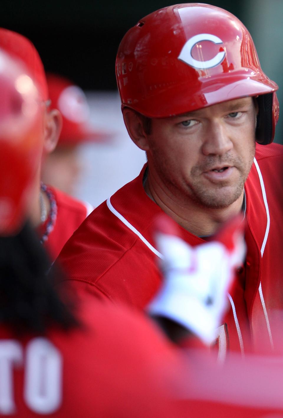 JUNE 23, 2012: Cincinnati Reds Scott Rolen (27) goes to congratulate starting pitcher Johnny Cueto (47) who laid down a sacrifice bunt that scored Rolen against the Minnesota Twins in the fourth inning.