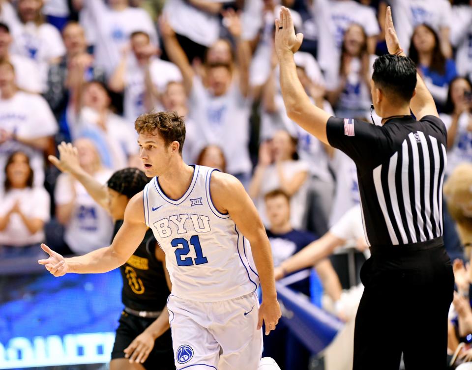 Brigham Young Cougars guard Trevin Knell (21) celebrates after hitting a three point shot as BYU and SE Louisiana play at the Marriott Center in Provo on Wednesday, Nov. 15, 2023. | Scott G Winterton, Deseret News