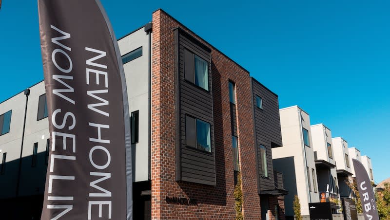 A sign in front of townhomes for sale in Salt Lake City on Monday, Oct. 30, 2023.