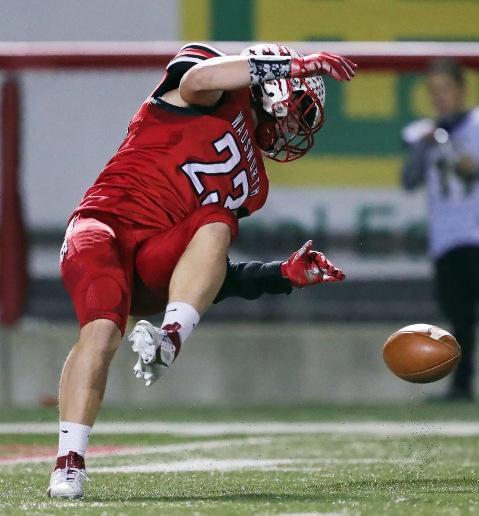 Wadsworth's Gavin Madigan fumbles a punt against Medina during a Division I regional quarterfinal against Medina on Friday in Wadsworth.